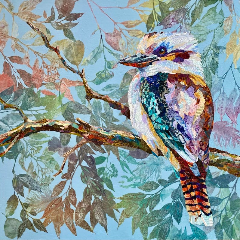 A realistic collage of a Kookaburra in a forest made with hand painted papers. Created by Amber Bennison Artist.