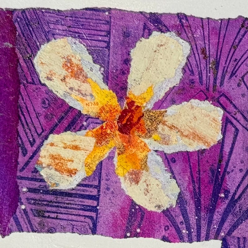 A single collaged flower made with patterned hand printed paper