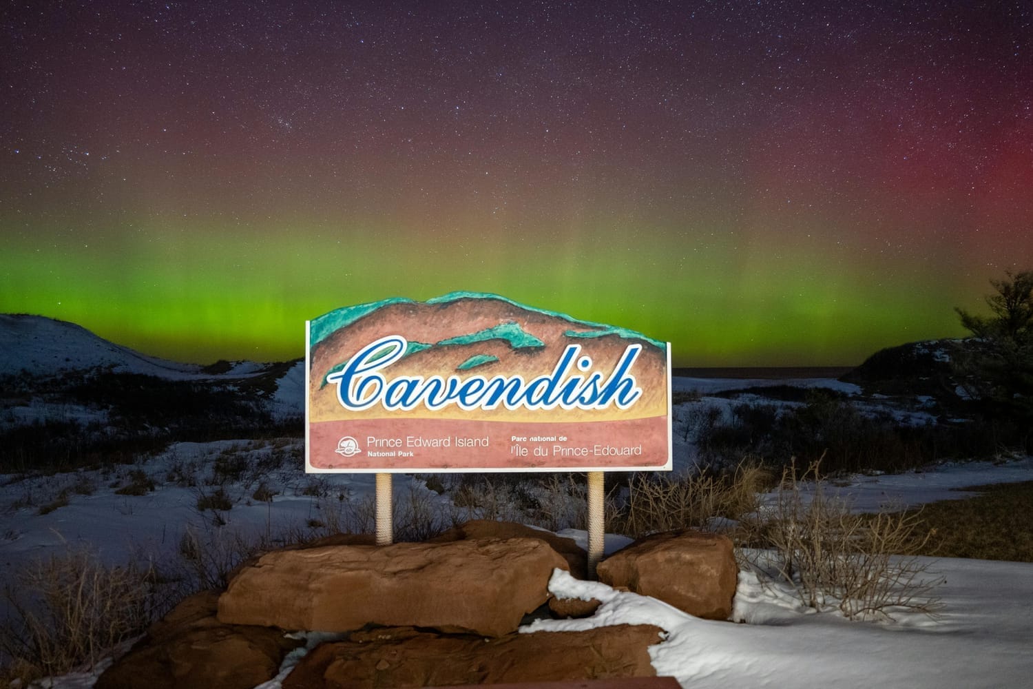 Wooden Signage near Aurora Borealis