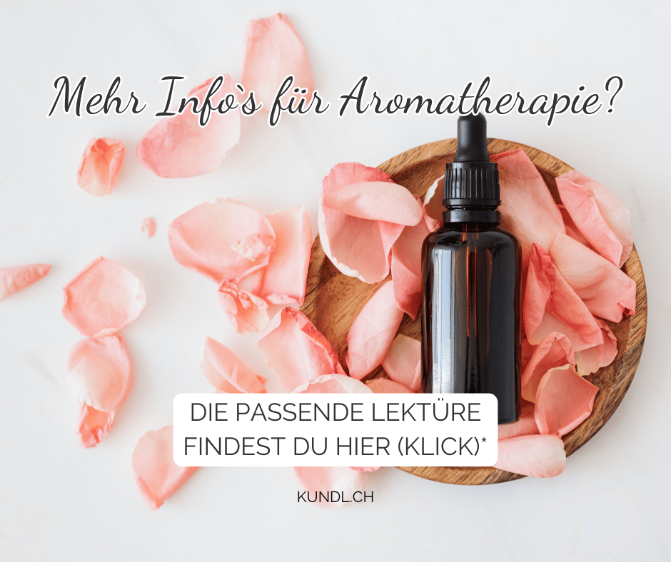 Aromaöl in einer Holzschale umgeben von Rosenblüten