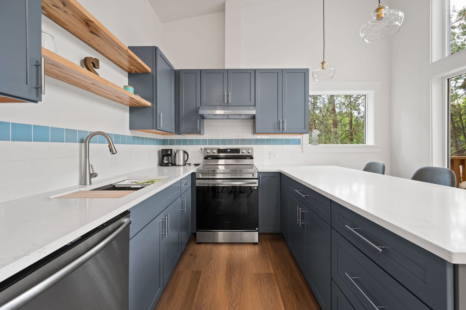 Open ADU kitchen with quartz island and efficient cabinetry
