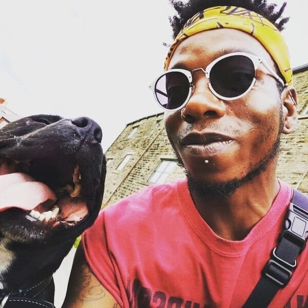 dog trainer with Staffie with tongue out