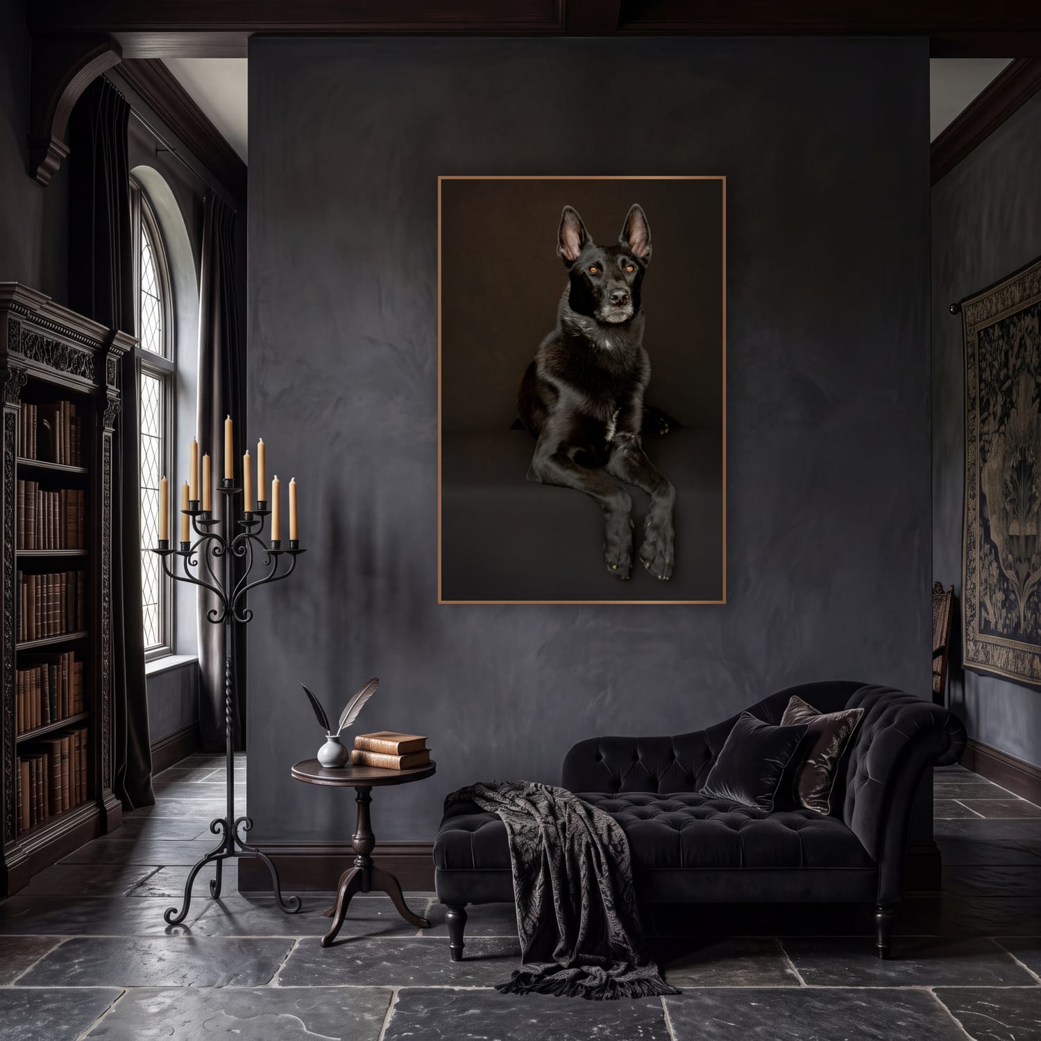Fine art portrait of a black shepherd mix hung above a velvet chaise in a candlelit library