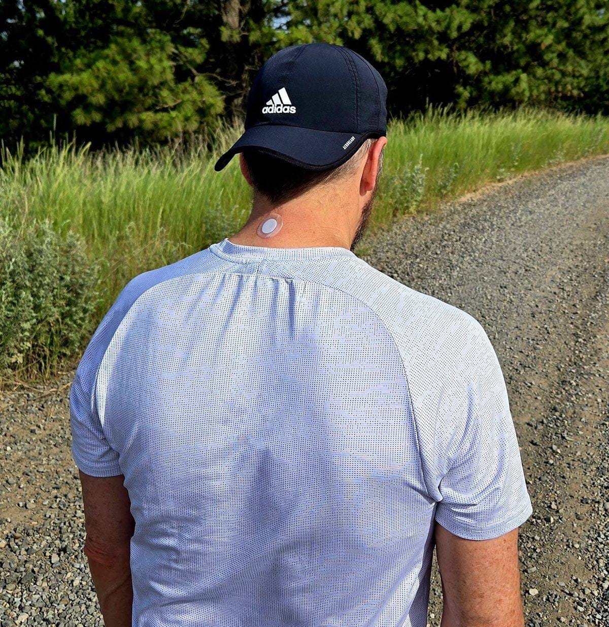 Joey on a gravel road wearing an X39 patch on the back of his neck