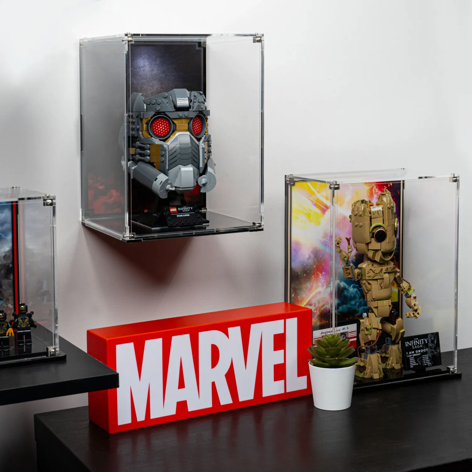 acrylic display cases with star-lords helmet in it