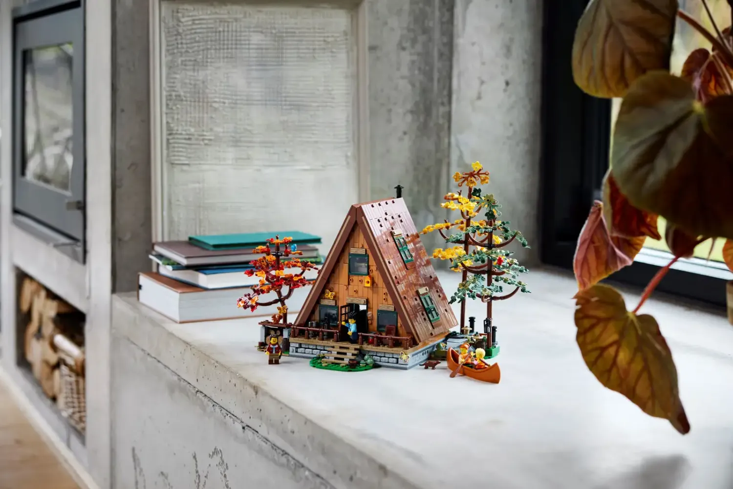 LEGO A-Frame Cabin display on the windowsill in rustic home decor style
