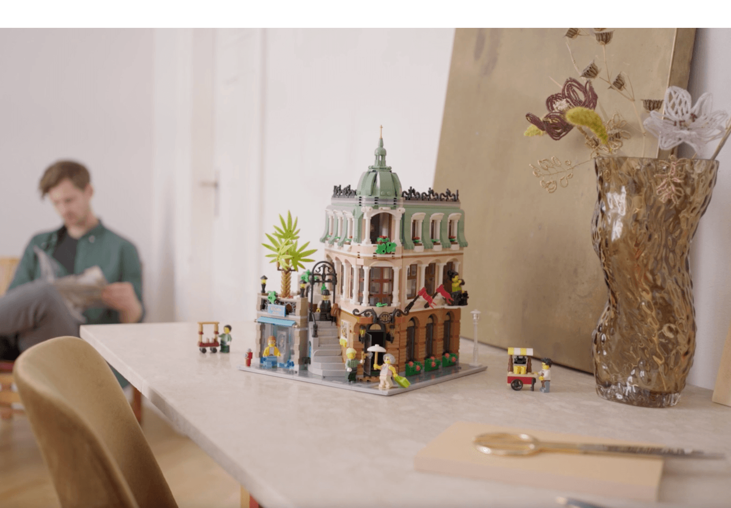 LEGO Hotel Boutique set beautifully displayed on a industrial decor style setting 