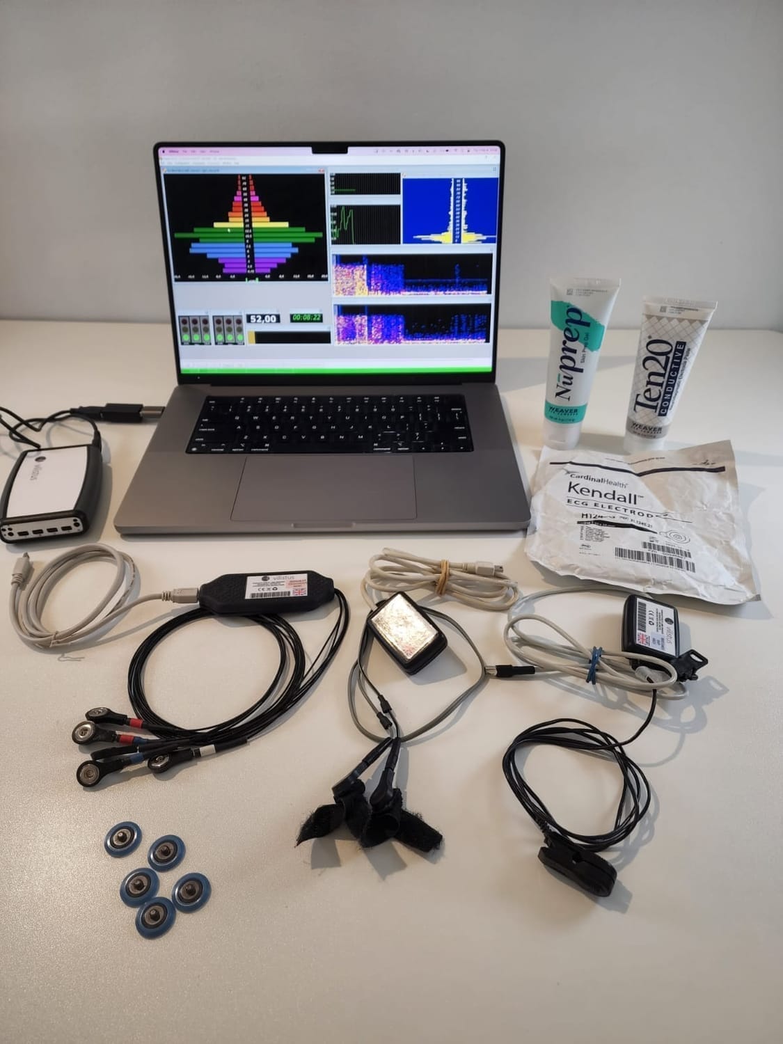 EEG and biofeedback setup used for measuring brainwave coherence and nervous system regulation.