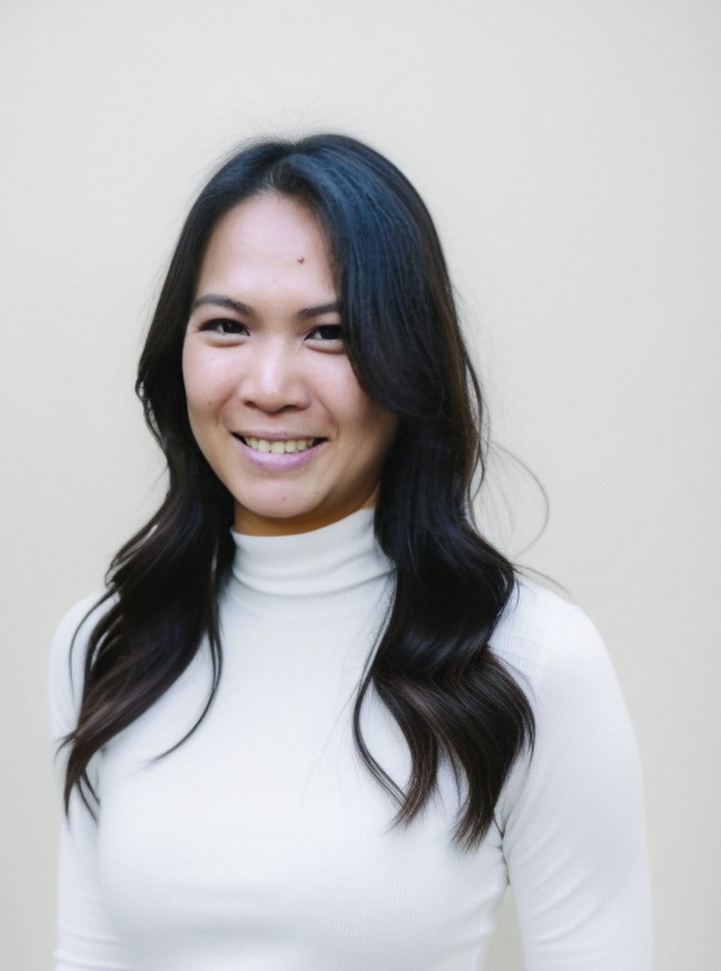 Professional portrait introducing Lila Devane, explaining her neuro-somatic approach and research background