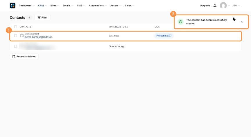 Contacts list with the new contact and a success message