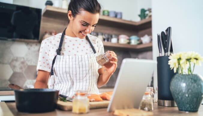 woman cooking healthy food for weight loss