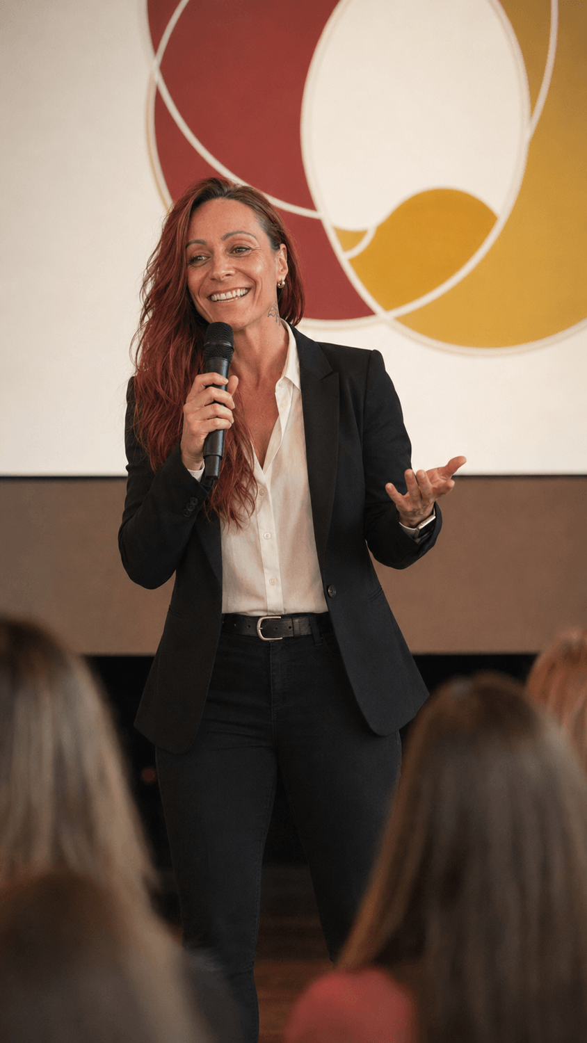Alexandra Valiquette speaking with an intimate audience