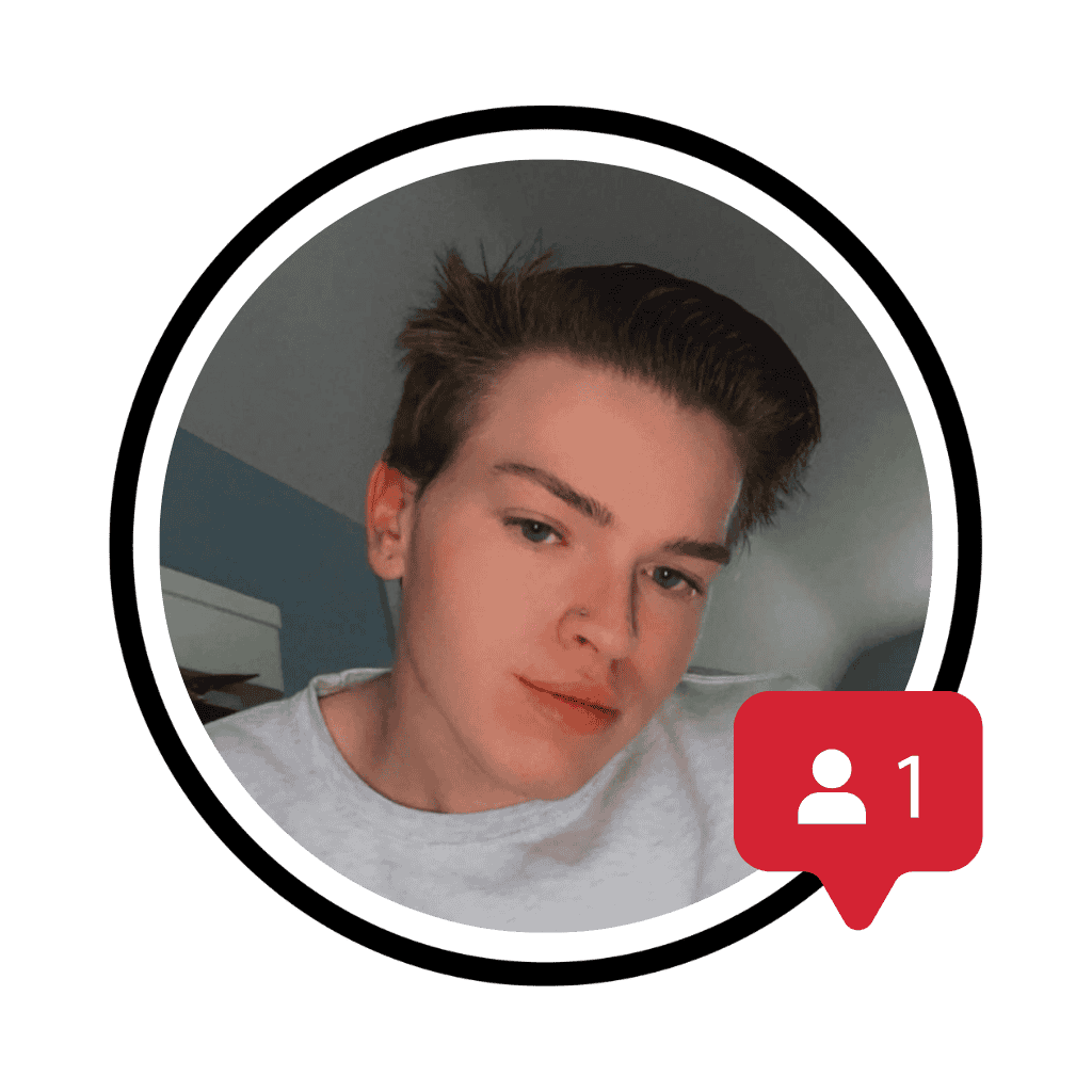 John Simmons with short brown hair and a grey crewneck