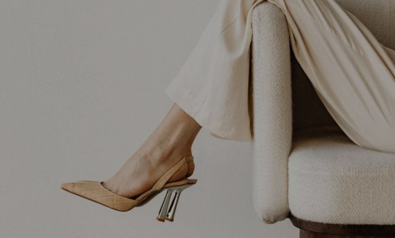 A freelance seo specialist lounging in a chair while she does seo services