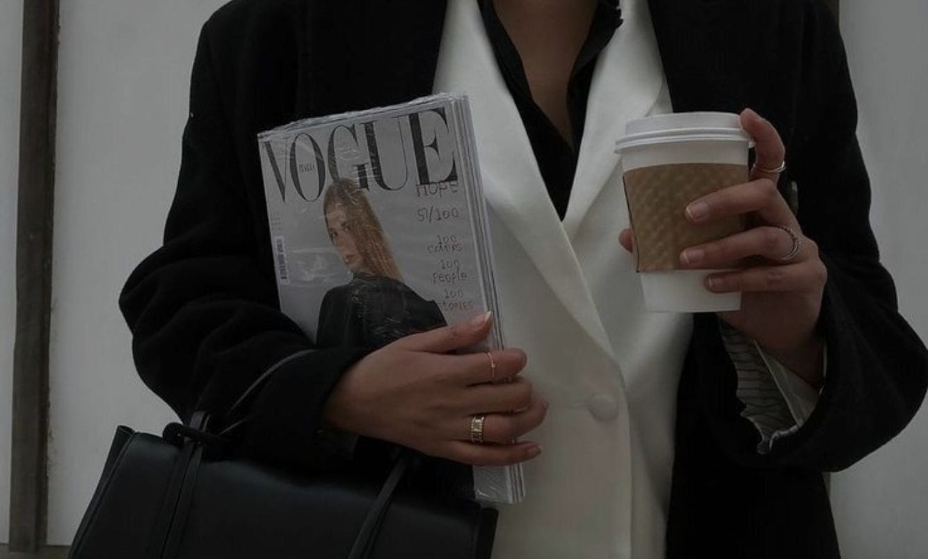 a website seo consultant holding a magazine and coffee