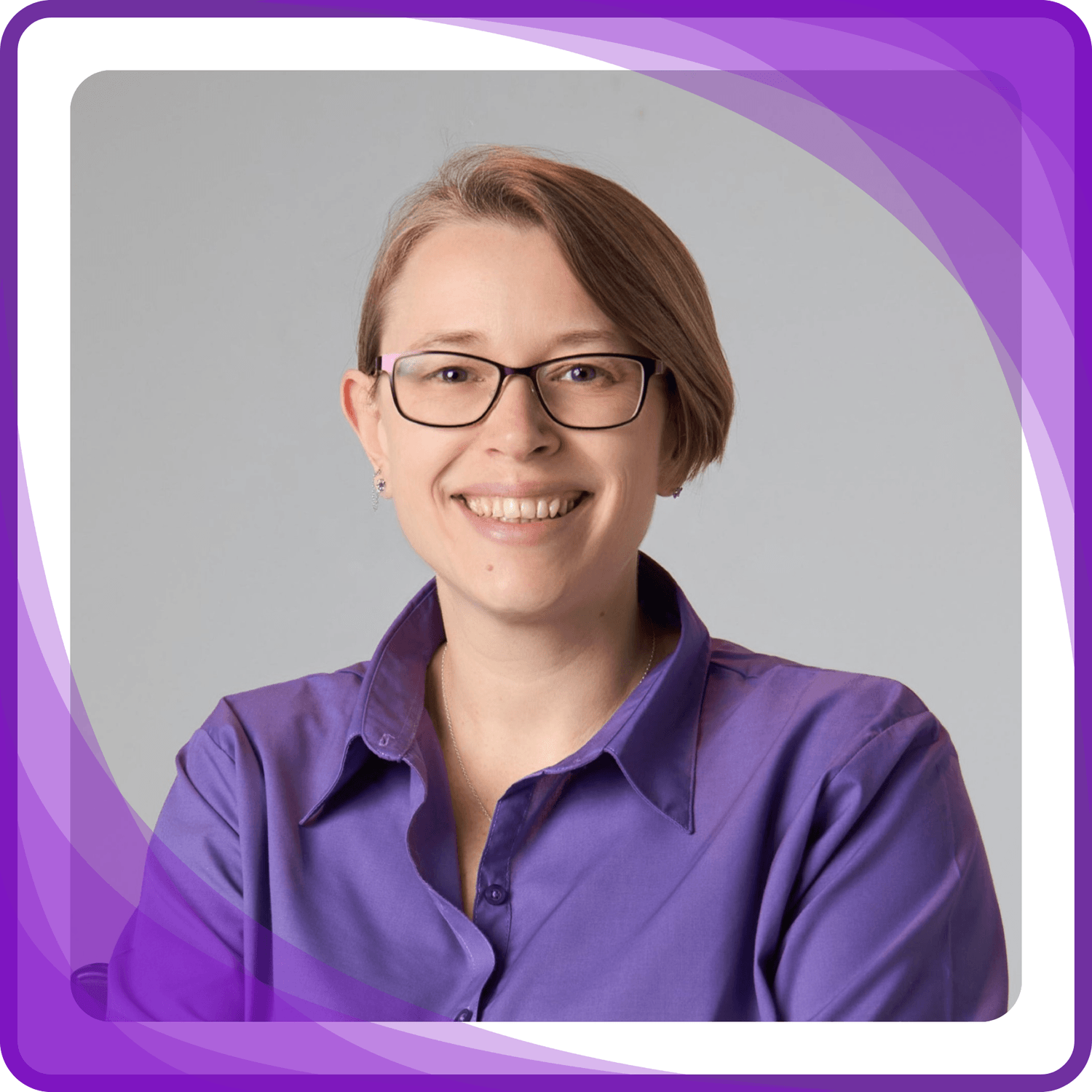 Headshot of Rae Dillon wearing a purple shirt with a purple border