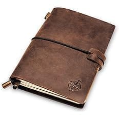Carnet bien être marron avec des fleurs, des oiseaux et des papillons qui vole
