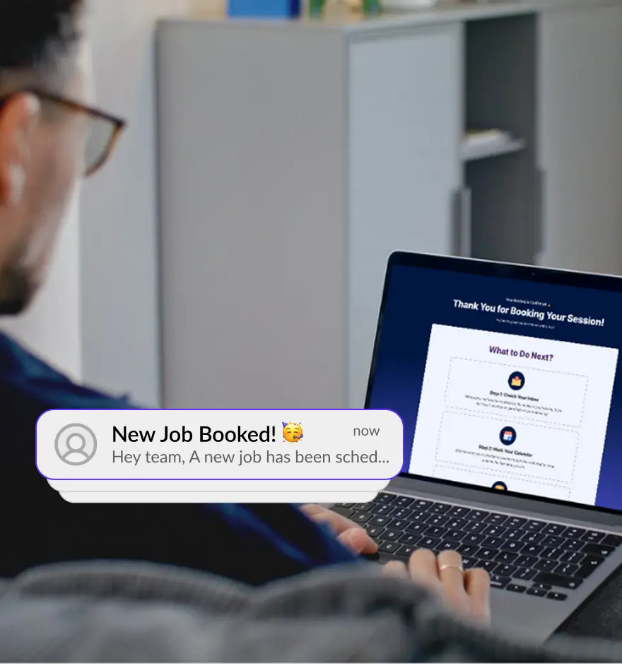 Home service provider viewing an online booking confirmation and new job notification on laptop