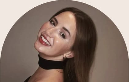 Portrait of Elle framed by a soft arch, founder of Awaken Through Love.