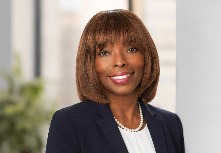 Dr. Cynthia Simon in navy business attire