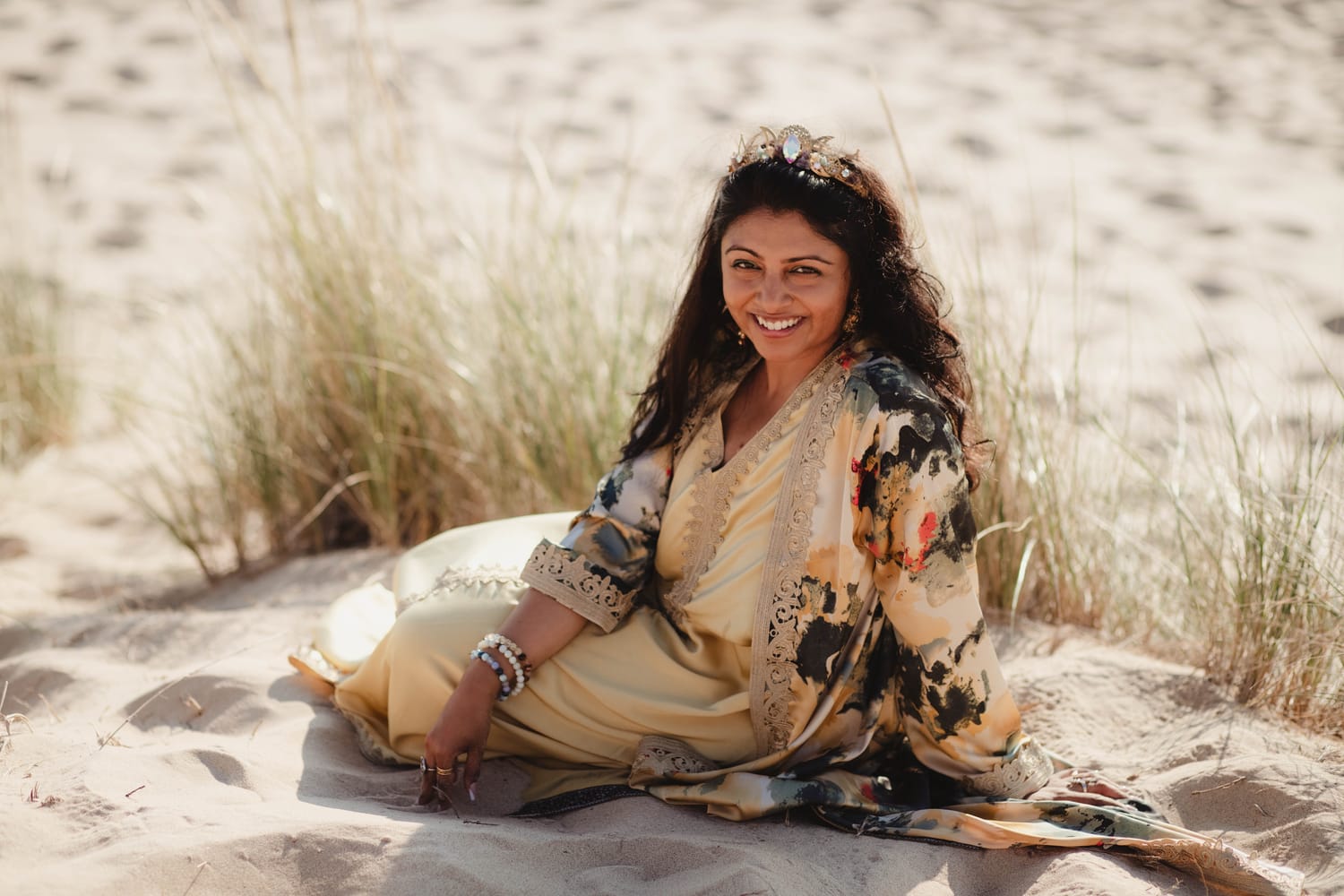 Nikhi Joshi looking directly at the camera on the beach
