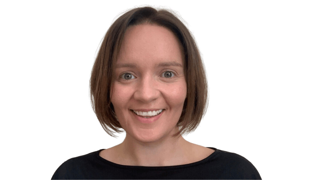 A picture of Verity Green head and shoulders - brown bob, smiling, black top