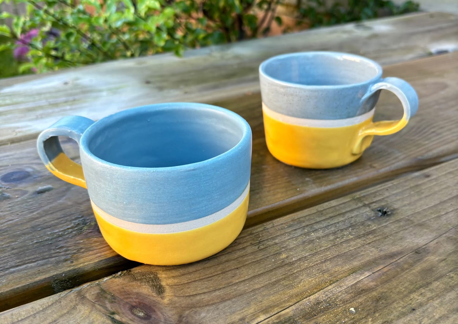 Blue and yellow handmade pottery mugs