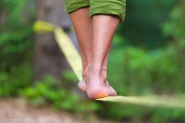 feet balancing on rope