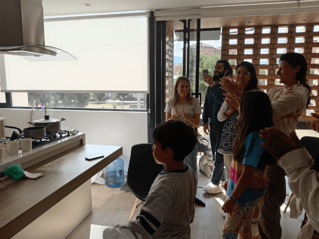 People in a home party in Cuenca near the big intersection of Avenida 12 de Octubre and Don Bosco