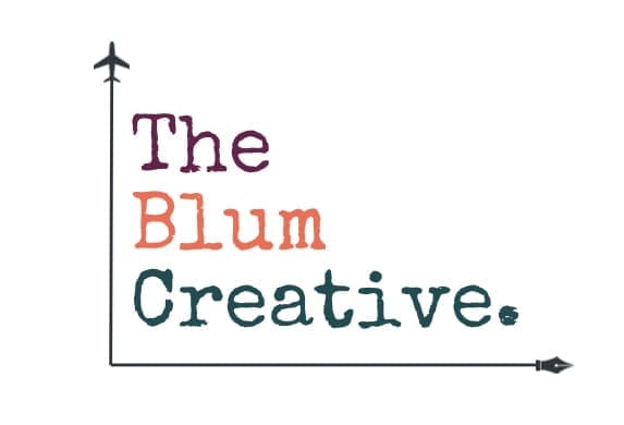 Logo for ‘The Blum Creative’ with the words stacked vertically in a typewriter-style font—‘The’ in dark purple, ‘Blum’ in orange-red, and ‘Creative.’ in teal. A black line with a small airplane icon on the top left runs vertically and then horizontally, ending in a pen nib on the right.