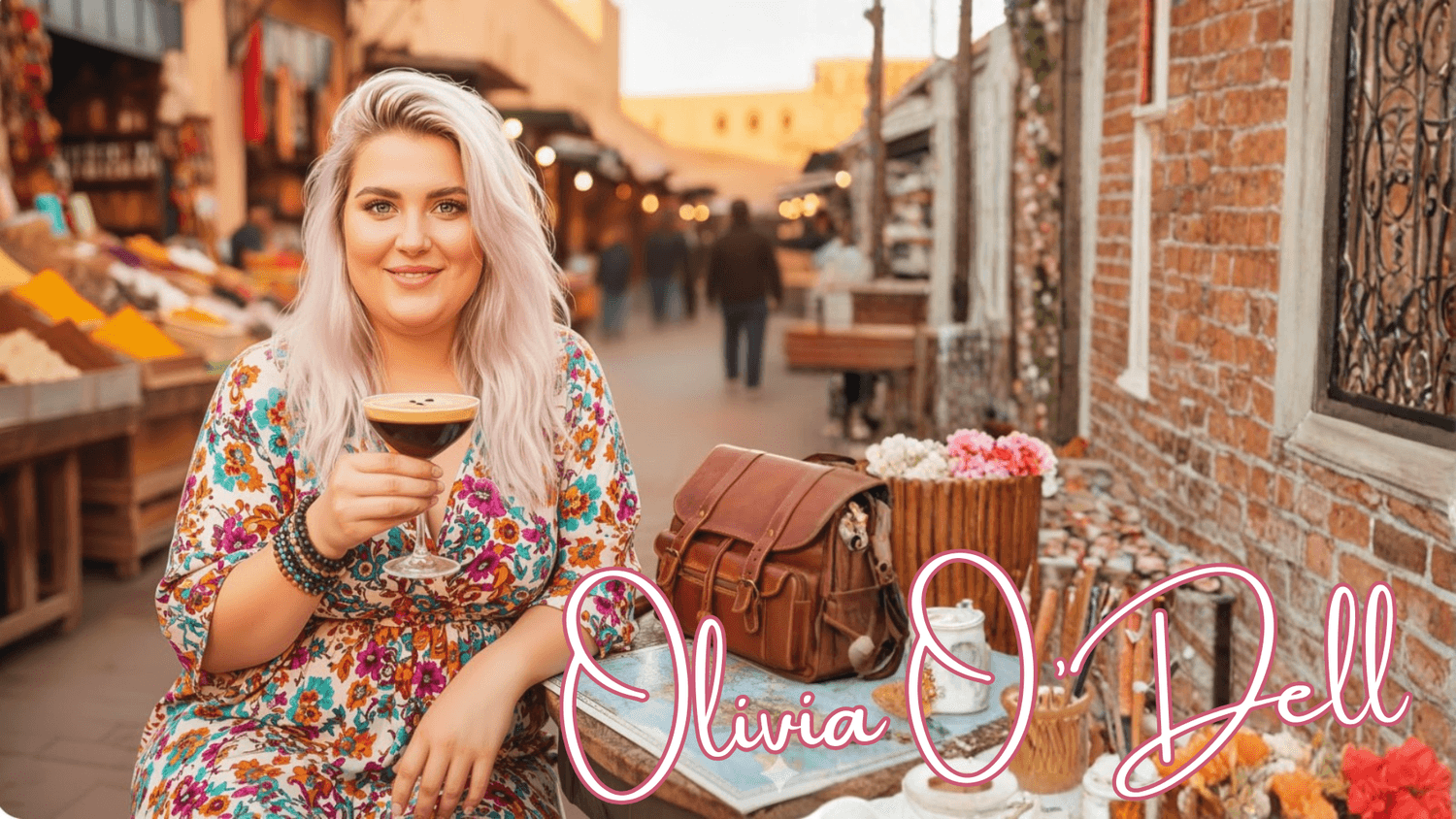 A woman sitting drinking an espresso martini in the streets of europe with her brown leather bag and map sitting on the table. She has blond hair and green eyes