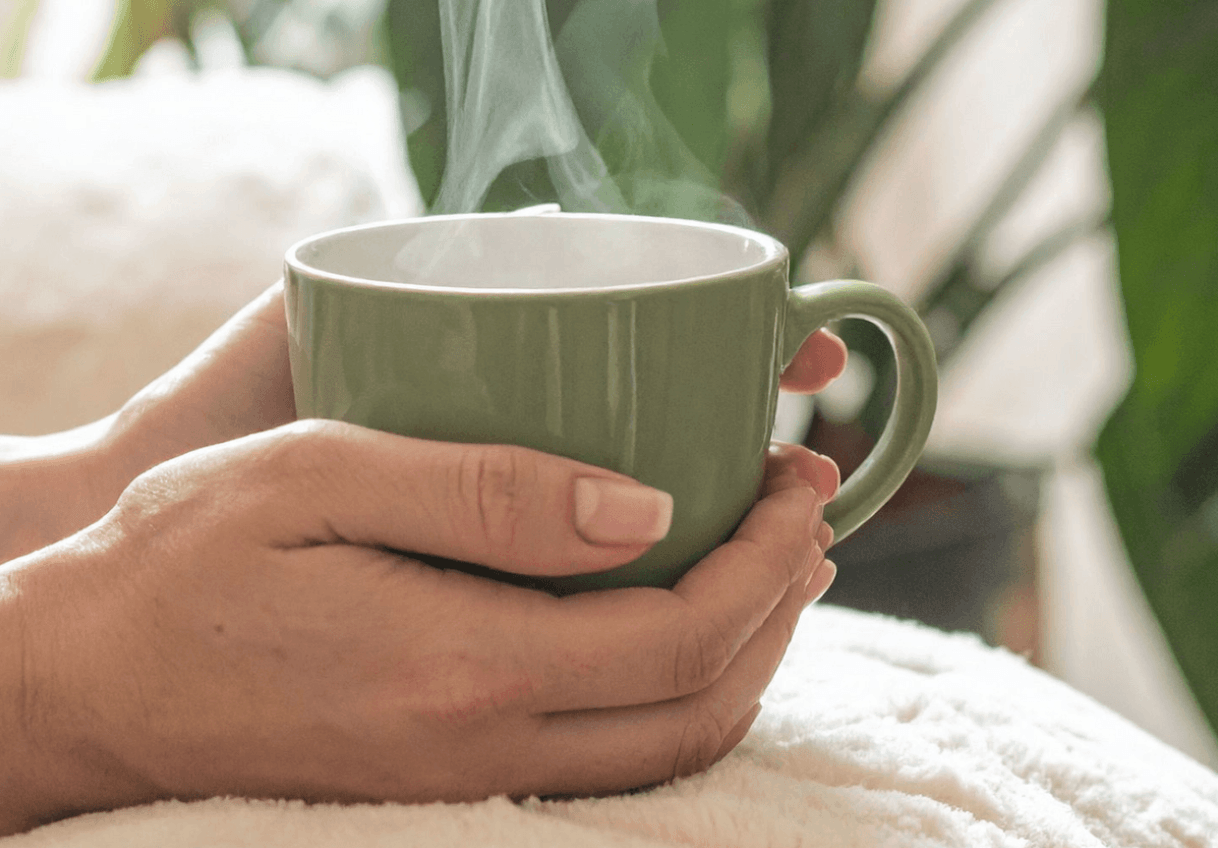 guilty mom holding a cup of coffee