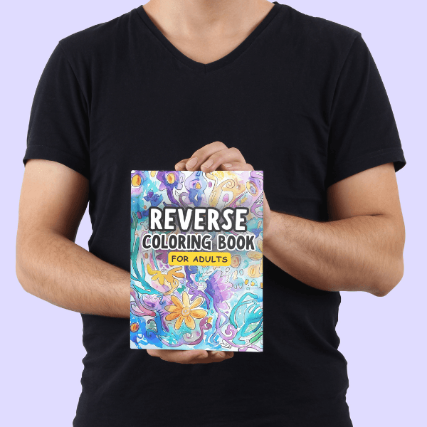 Person holding the Reverse Coloring Book for Adults featuring abstract watercolor art cover. Printable creative relaxation book designed for mindfulness and stress relief.