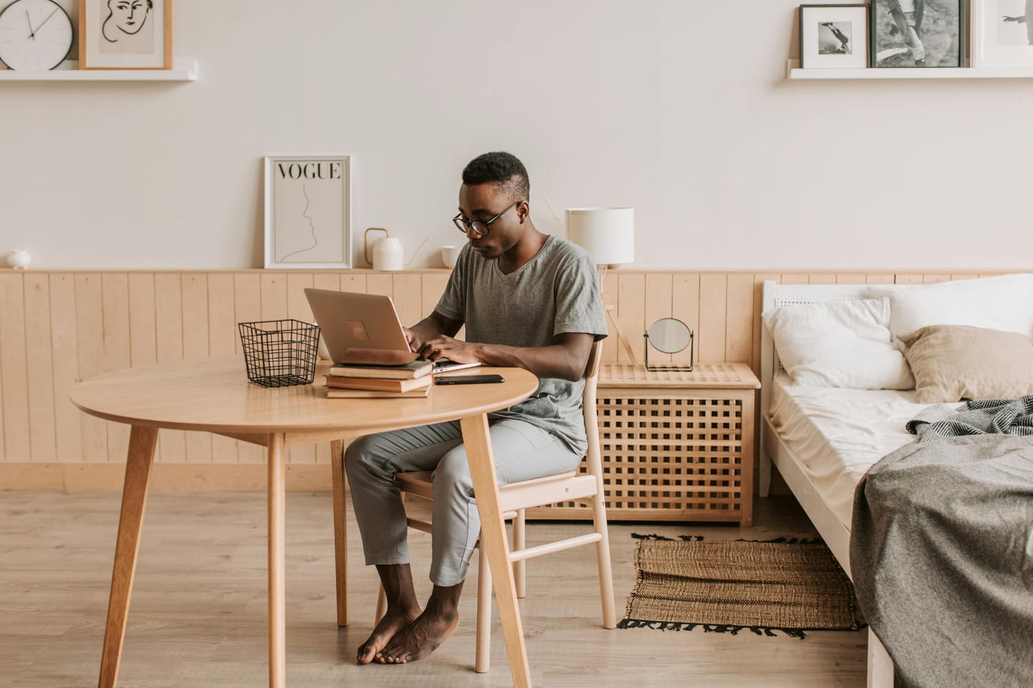 Person working remotely with laptop, representing the Exitus Elite digital business model