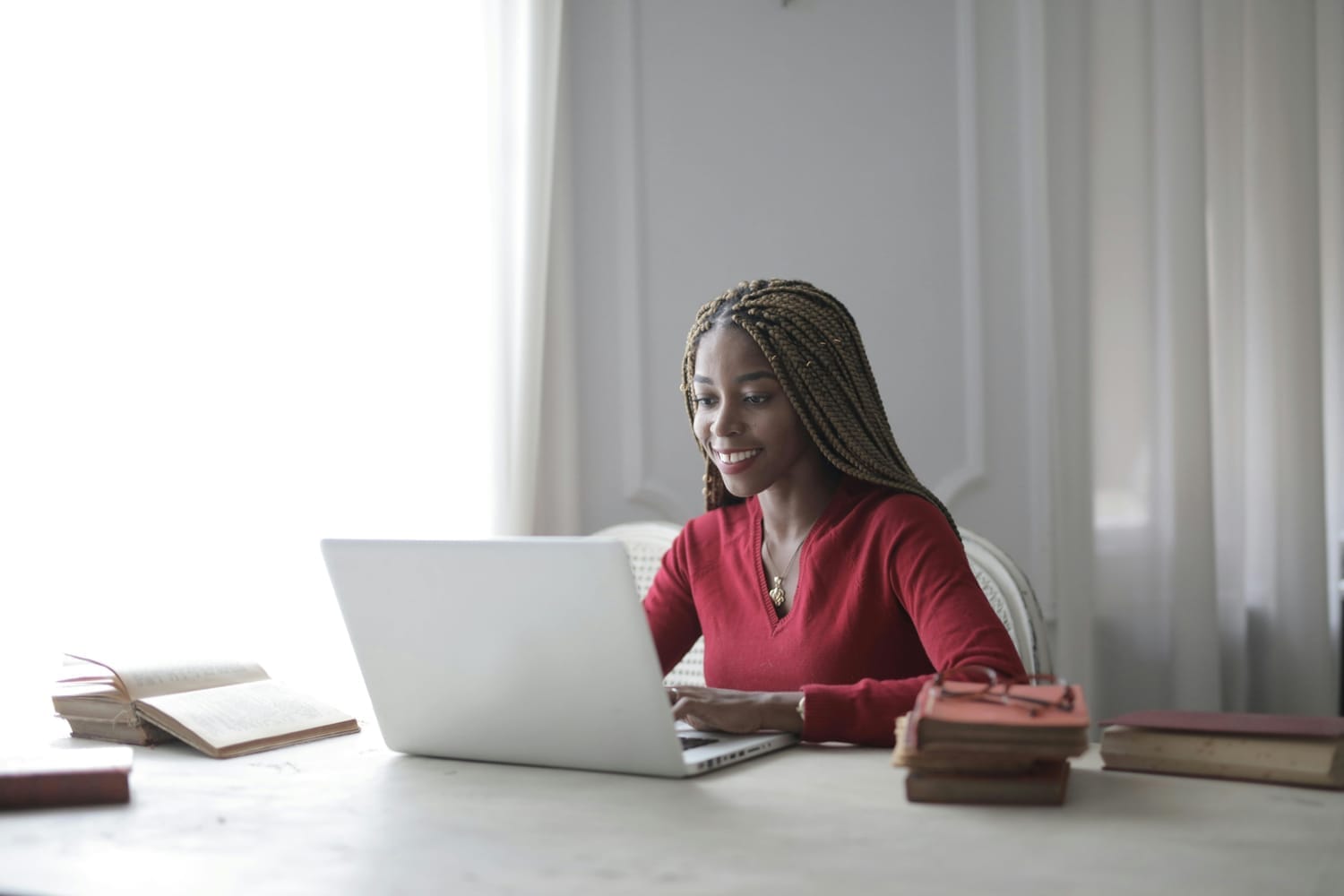 Image of a remote worker at a laptop with chat windows open - SocialSaleRep & Social Sale Rep training in action.