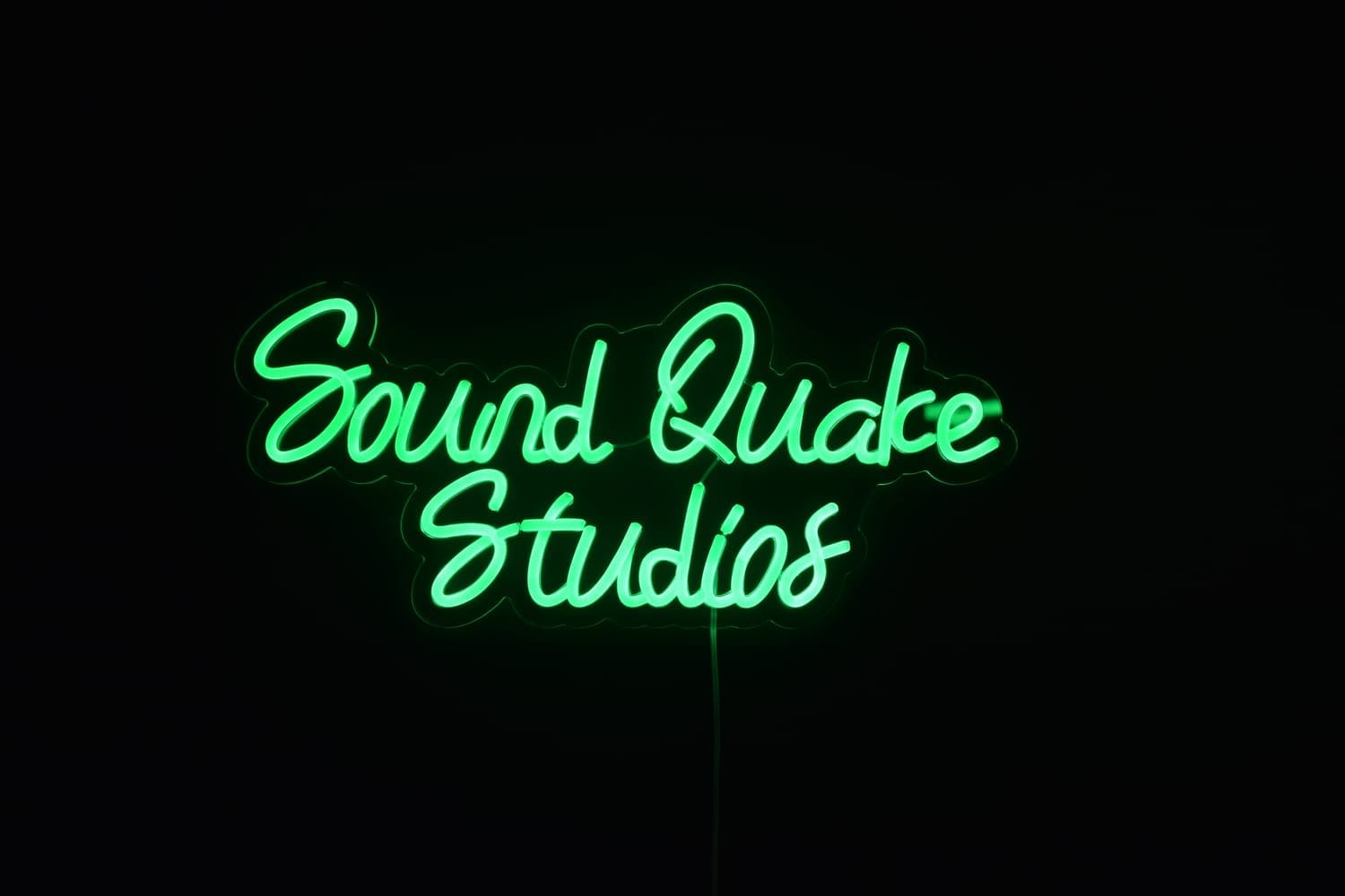 Sound Quake Studios neon sign glowing inside Cape Breton recording studio