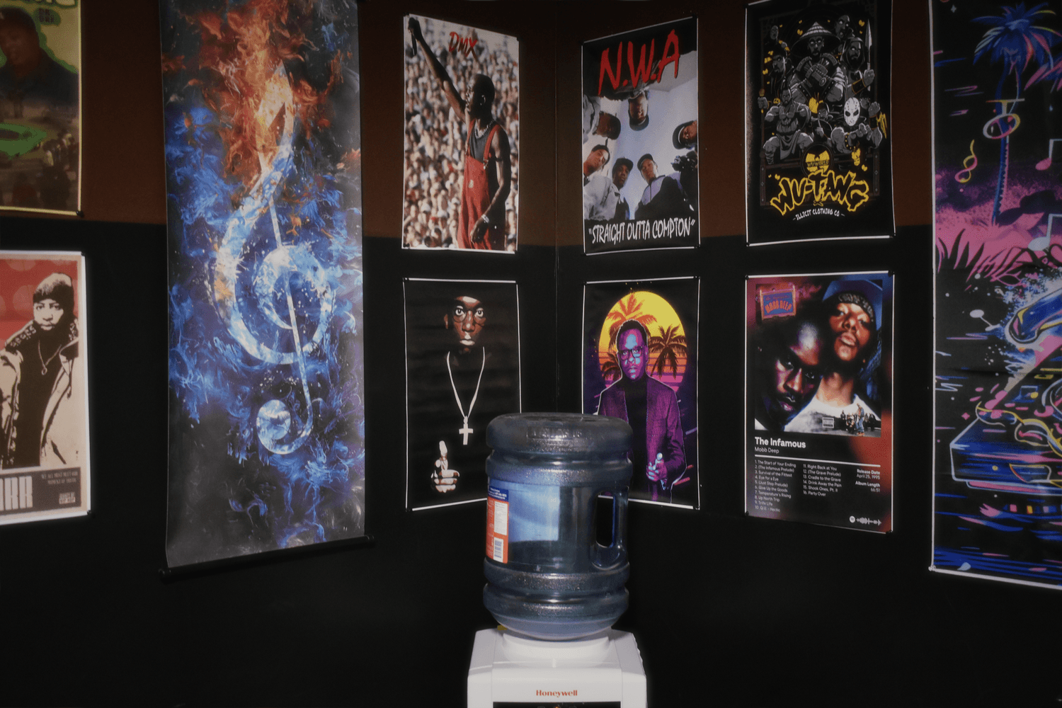 Wall of framed photos featuring legendary rappers Tupac, Young Noble, DMX, Eazy-E, N.W.A. inside Sound Quake Studios Cape Breton