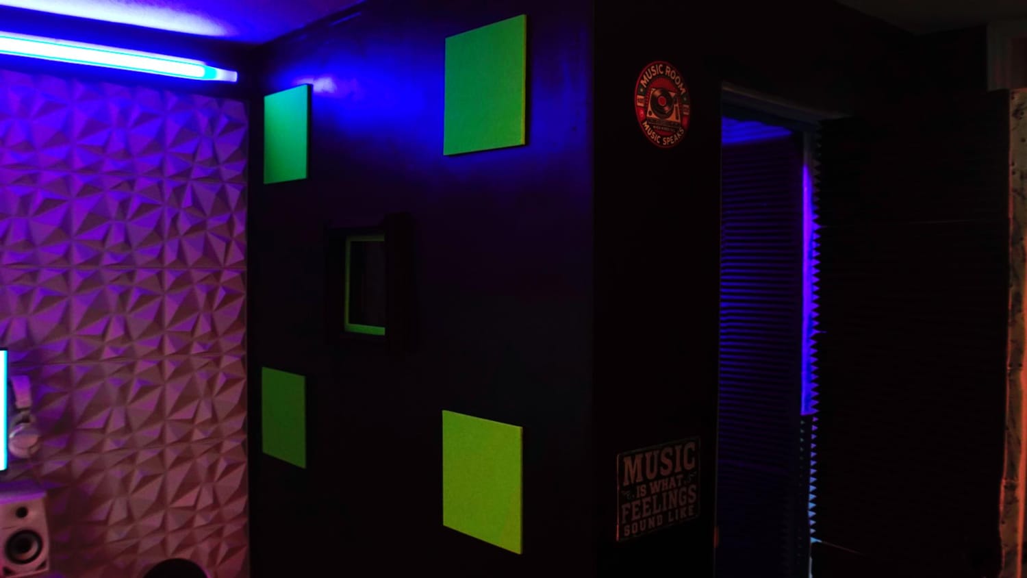 Music production setup with computer, mixing equipment, and monitors at Sound Quake Studios Cape Breton