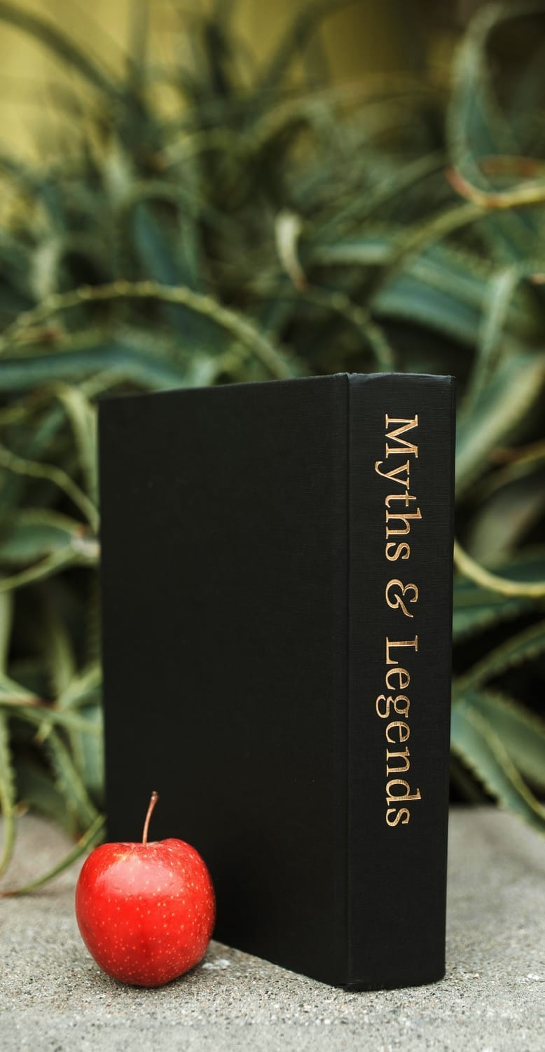 Myths and Legends book with red apple