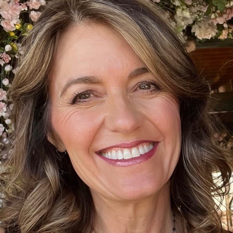 Smiling white woman with golden blond hair