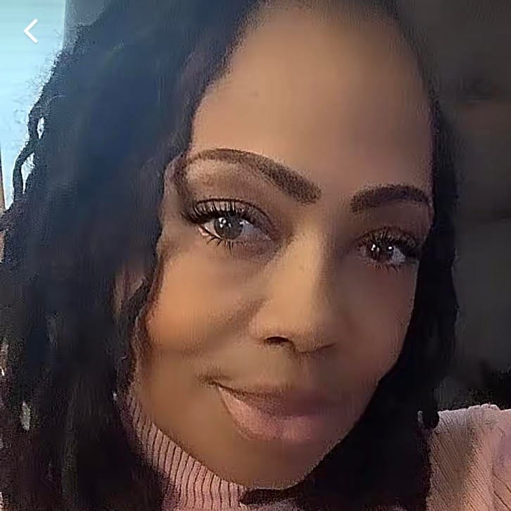 Photo of beautiful black woman with curly black hair