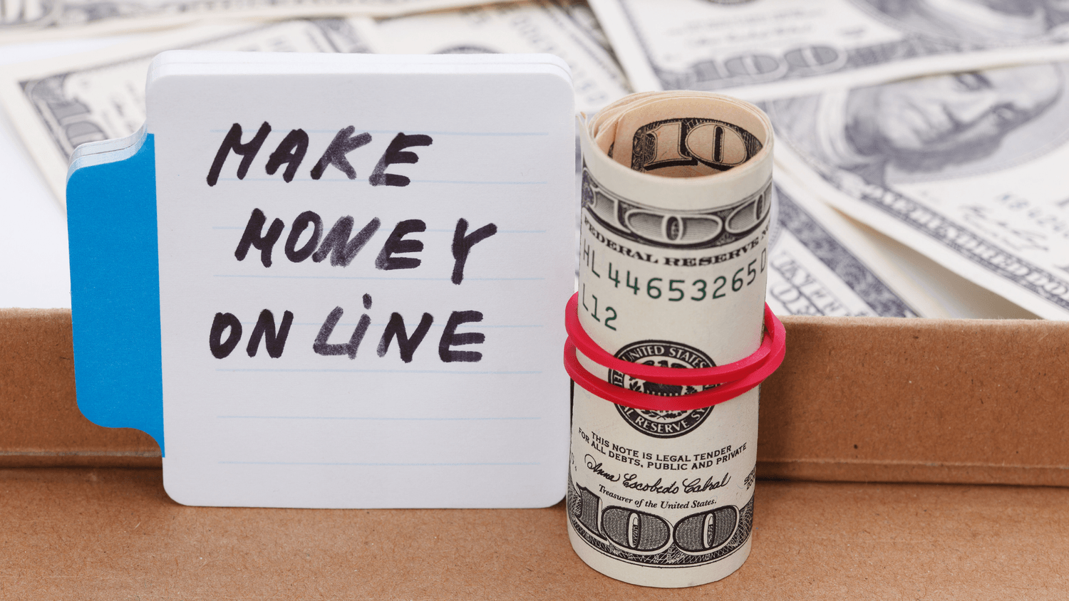 Make money online message with cash – symbol of online business income