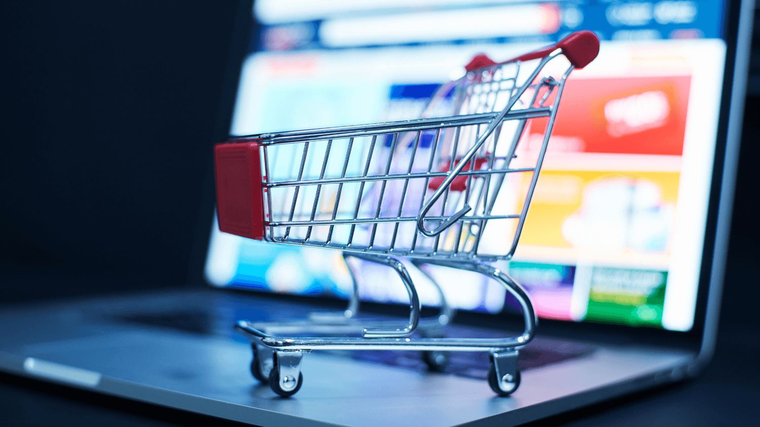 E-commerce and online business – shopping cart on computer representing digital sales