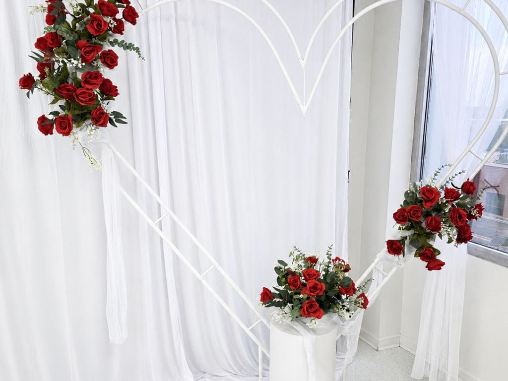 Heart-shaped floral backdrop for engagement parties and proposals