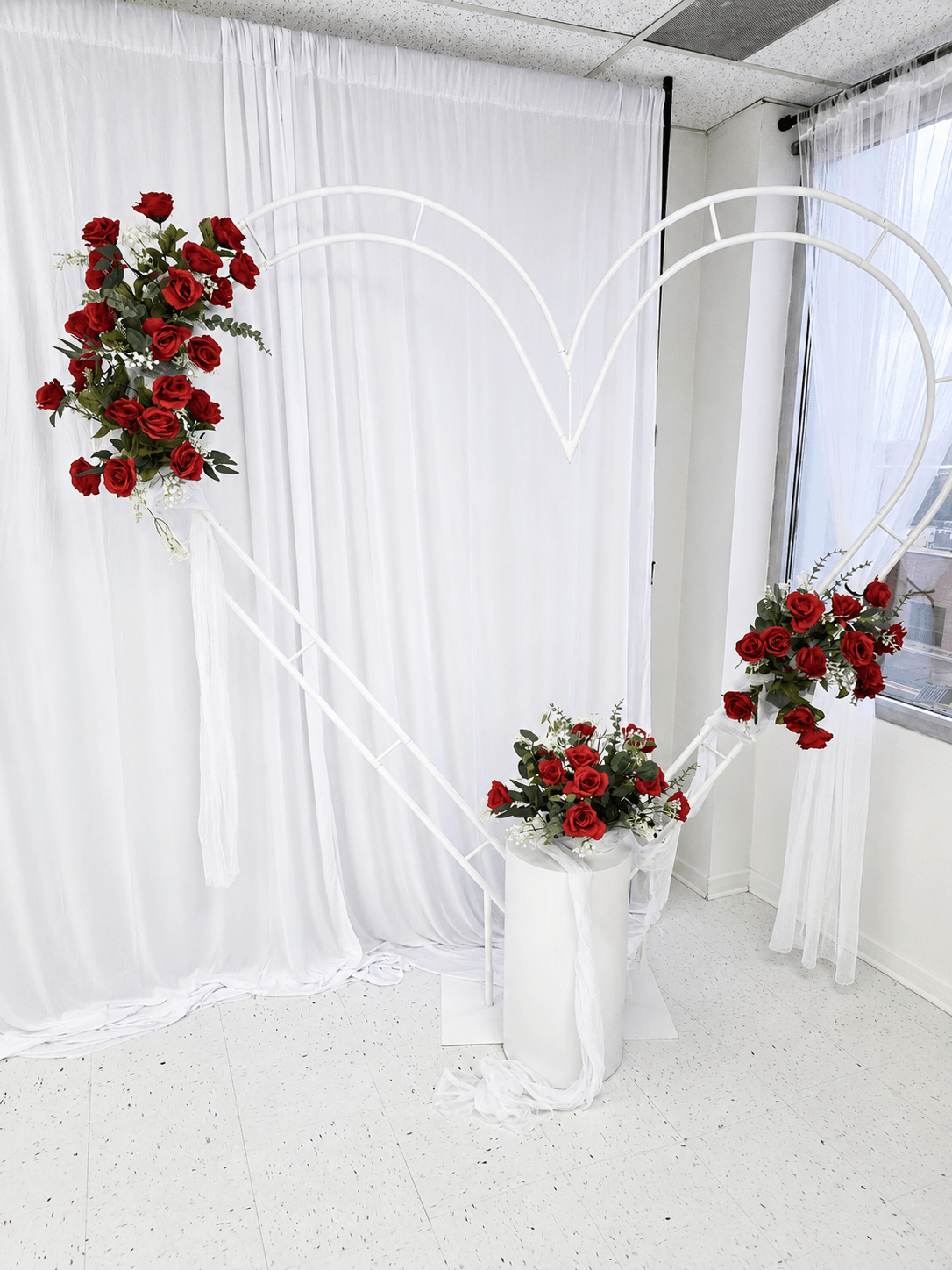 Large heart shaped stand with red roses and flowers at TD Event Space