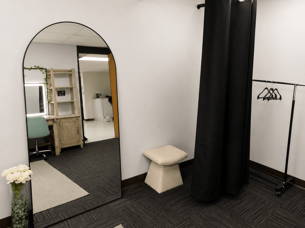 Private dressing room with mirror and changing area