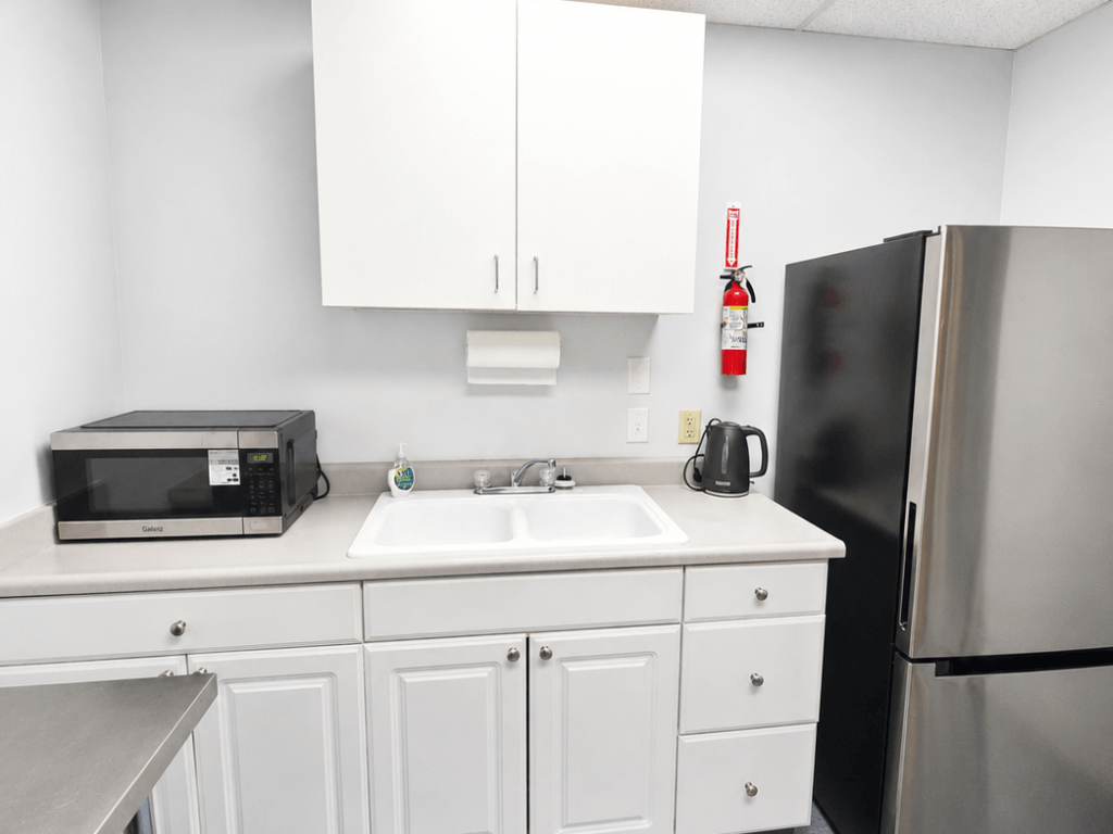 Commercial event kitchenette with sink fridge and microwave