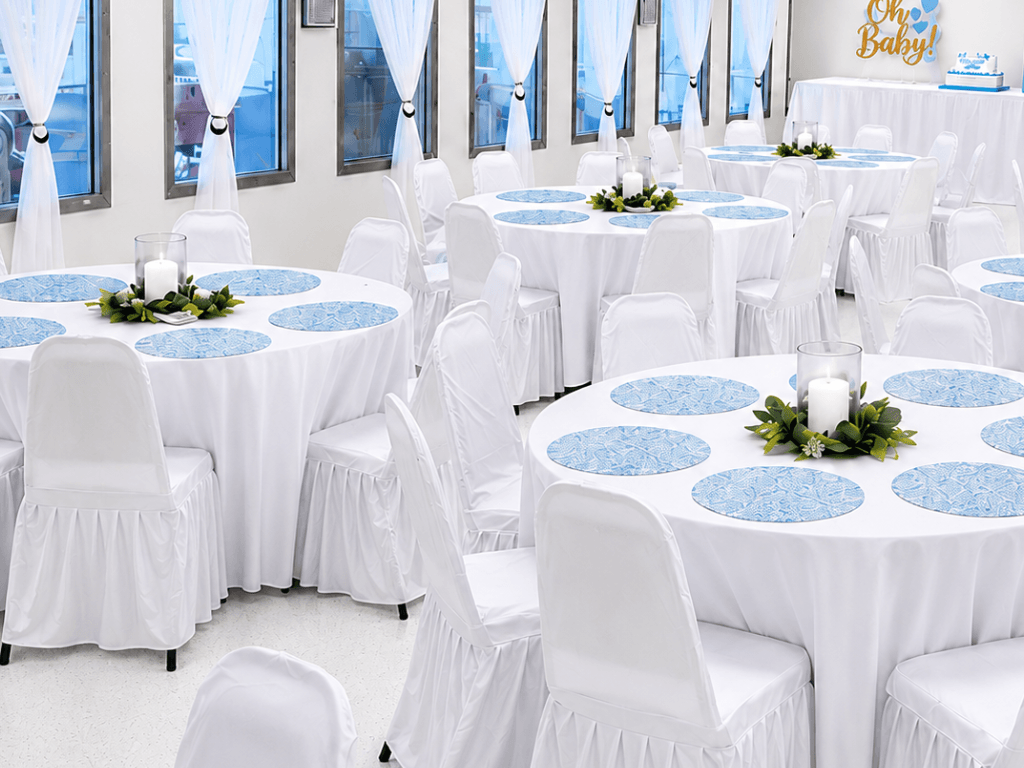 Baby shower reception setup with blue table décor
