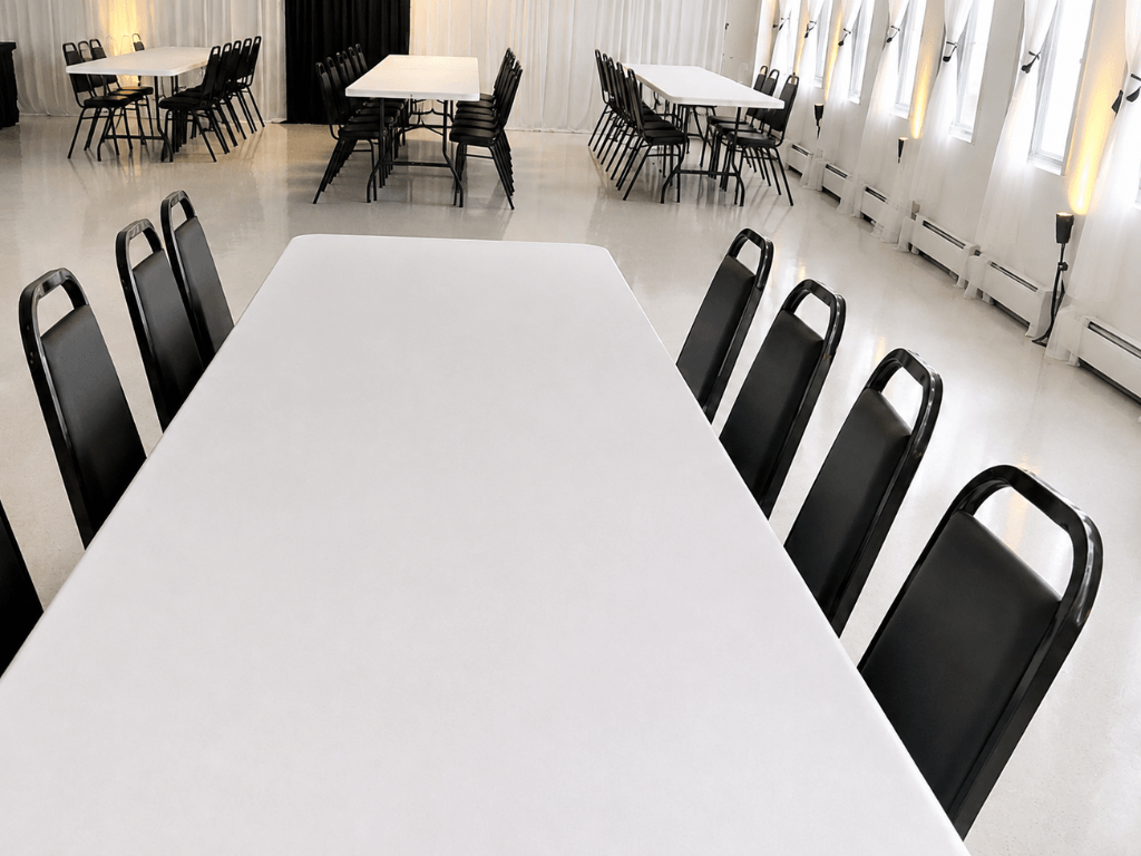 blank canvas package with rectangle tables and black banquet chairs