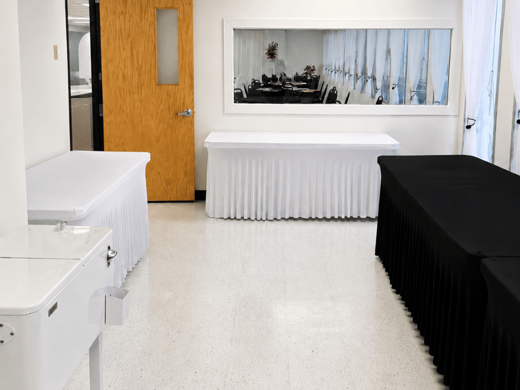 Buffet and beverage service area setup with Chafing Dishes and Ice cooler